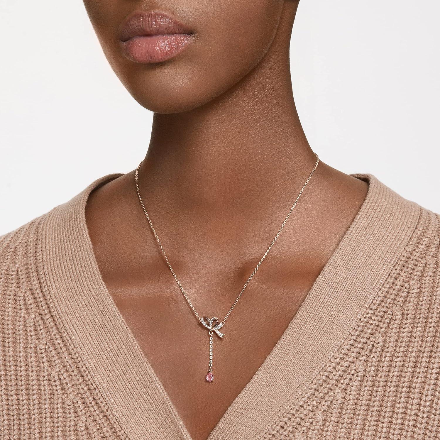 imageSwarovski Volta Necklace Earrings and Bracelets Jewelry Collection BowInspired Pink and Clear Crystals with RoseGold Tone FinishY Pendant Necklace