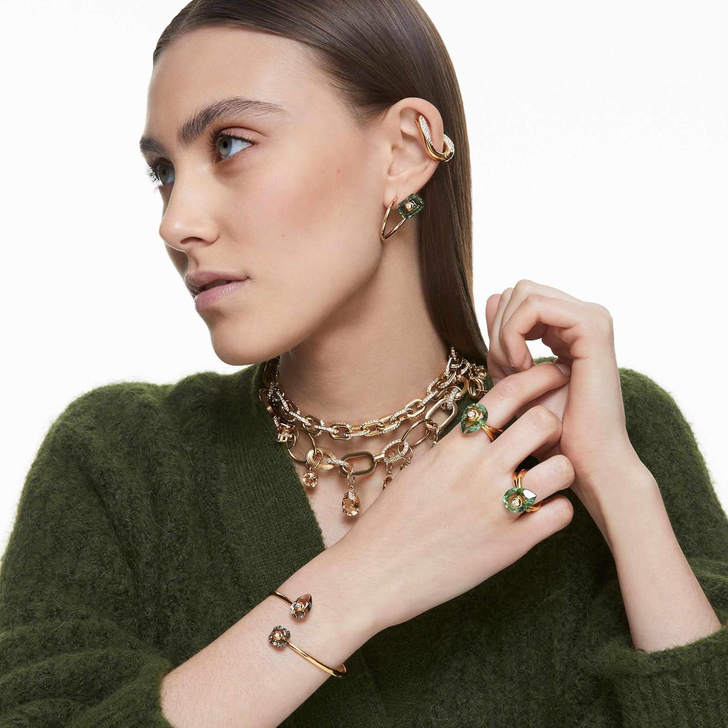 imageSwarovski Numina Earring Jewelry Collection Gold Tone Finish Green Crystals Clear CrystalsAsymmetrical Earrings